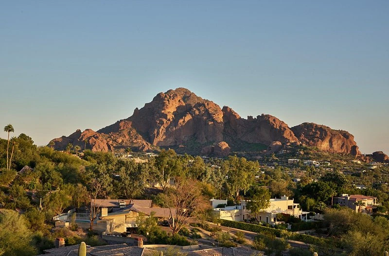 Scenic view of Scottsdale, Arizona, with desert homes, native vegetation, and Camelback Mountain in the background.